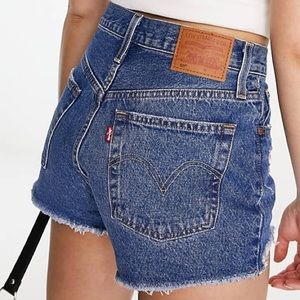 501 high rise cutoff shorts in a medium wash